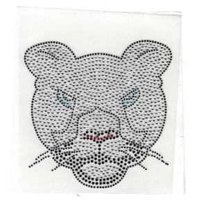 May include: A gray panther face made of rhinestones. The panther has blue eyes and a red nose.