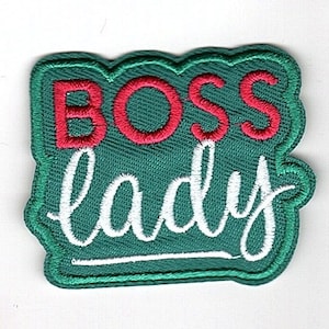 May include: Green embroidered patch with the text "BOSS lady" in white and red lettering.