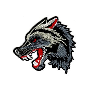 May include: Embroidered iron-on patch featuring a snarling wolf head with black, gray, and red details.