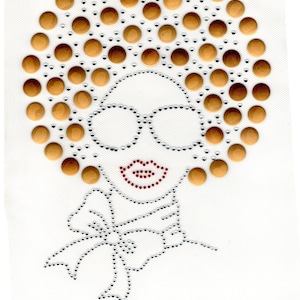 May include: A rhinestone design of a woman with an afro hairstyle, wearing glasses and a bow. The afro is made of gold rhinestones, the glasses are silver, and the bow is silver with a white center.