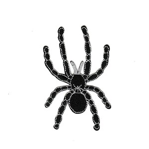 May include: Black embroidered spider patch with a detailed design.