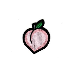 May include: A pink peach with a green leaf and black outline. The peach is embroidered with a textured design.