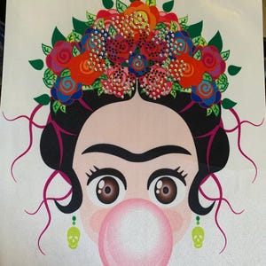 May include: A colorful illustration of a woman with a floral headdress, large eyebrows, and a bubblegum bubble. The woman has dark hair, brown eyes, and green skull earrings. The floral headdress is adorned with rhinestones.
