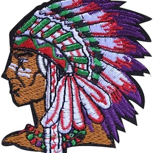 May include: Embroidered patch of a Native American man wearing a colorful headdress with purple, red, white, and green feathers. The man's face is brown with white paint markings.