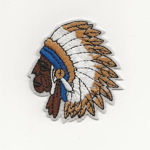 May include: Embroidered iron-on patch featuring a profile of a Native American wearing a headdress with brown, white, and blue feathers.