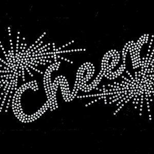 May include: The word "cheer" spelled out in white rhinestones on a black background.