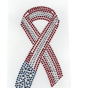 May include: A red, white, and blue ribbon made of rhinestones in the shape of the American flag.