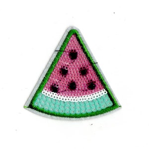 May include: A pink and green watermelon slice patch made of sequins. The watermelon slice is a triangle shape with a white border.