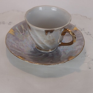 Vintage iridescent gray Japanese demitasse tea cup and saucer set lustreware swirl design gold trim collectible porcelain made in Japan