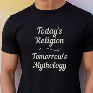May include: A black t-shirt with the text "Today's Religion Tomorrow's Mythology" printed in white.