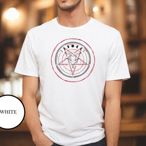 Satanist bartender wearing white Satanic magical shirt that features Baphomet, moon phases, magical circles, and a pentagram for the ultimate gift for a witch or a fan of witch horror.