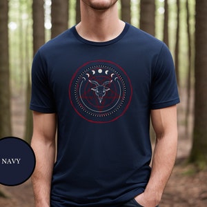 male witch wearing blue goth witchcraft shirt that features Baphomet, moon phases, magical circles, and a pentagram for the ultimate gift for a witch or a fan of witch horror.
