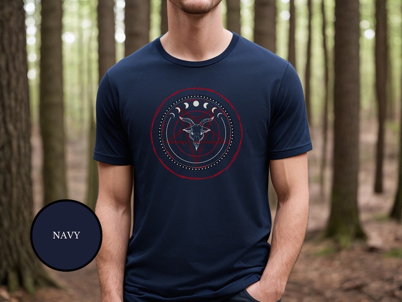male witch wearing blue goth witchcraft shirt that features Baphomet, moon phases, magical circles, and a pentagram for the ultimate gift for a witch or a fan of witch horror.