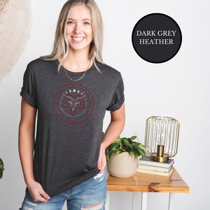 blonde witch wearing gray goth Satanic witch shirt that features Baphomet, moon phases, magical circles, and a pentagram for the ultimate gift for a witch or a fan of witch horror.