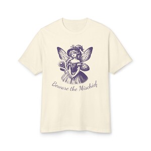 Unisex Faded Cream Vintage Style Retro Fairy Grunge T-Shirt featuring a Purple Winged Fairy and the sarcastic saying Beware the Mischief in this cute whimsical nature shirt for fairy lovers