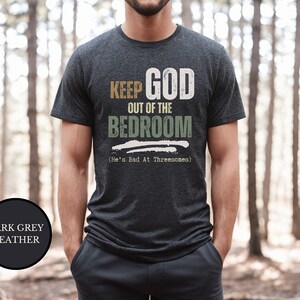 Young Christian Man Wearing a sarcastic shirt that says Keep God Out Of The Bed Room - He's Bad At Threeways - retro vintage style asthetic
