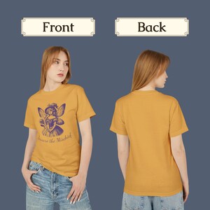 May include: A mustard yellow t-shirt with a purple fairy graphic and the text "Beware the Mischief".