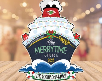 May include: A blue and red Christmas ornament featuring a Disney Cruise ship with the text "Very Merrytime Cruise 2023" and "The Robinson Family".