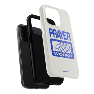 May include: White phone case with a blue graphic that says "PRAYER WORKS" with a globe inside a square.