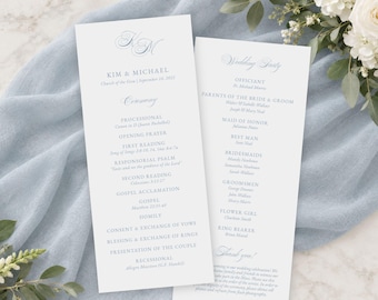 May include: Two white wedding program cards with light blue text. The left card features the names Kim & Michael, the date, and the ceremony order. The right card lists the wedding party members, including the officiant, parents, and attendants.