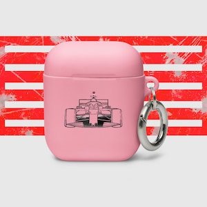May include: A pink Airpods case featuring a black outline of a racing car on the front. The case has a silver metal loop attached to the side.