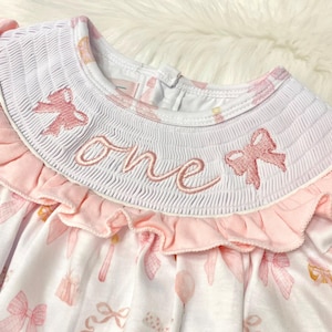 fancy one pink bow first birthday girl romper pink and white outfit, pink white smocked bubble romper first birthday winter bows ruffle bows  embroidered smocked long sleeve 1st birthday outfit romper baby girls