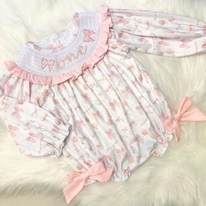 pink bow first birthday girl romper pink and white outfit, girsl just want to be one pink white smocked bubble romper first birthday winter bows ruffle bows  embroidered smocked long sleeve 1st birthday outfit romper baby girls