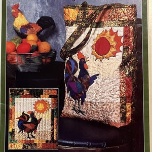 May include: A colorful tote bag and wall quilt pattern titled "Roosterific!" featuring a rooster and sun design. The tote bag has a rooster applique and a sun design. The wall quilt has a similar design. The text "THE QUILTED CLOSET" is also visible.
