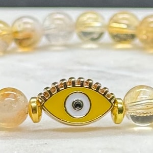 Citrine Crystal Bracelet with Evil Eye Charm & Gold Hematite Accent Beads