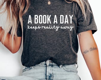 Funny Reading Shirt: A Book A Day Keeps Reality Away