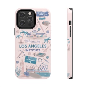 May include: A light pink phone case featuring a Los Angeles-themed design. The case includes illustrations of palm trees, buildings, and the text "Welcome to Los Angeles Institute." The case also has a black camera module.