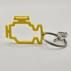 Llavero divertido con luz de revisión del motor – Dije amarillo de advertencia para el tablero impreso en 3D – Regalo para amantes de los autos, llavero de broma para mecánicos