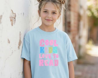 Camiseta juvenil / Camiseta retro en tonos pastel con el lema "A los niños les encanta leer".