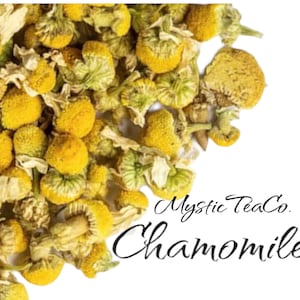 May include: Dried chamomile flowers, a pale yellow colour, with some white petals. The flowers are arranged in a loose pile, with some overlapping. The text "Mystic TeaCo. Chamomile" is written in black cursive script at the bottom of the image.