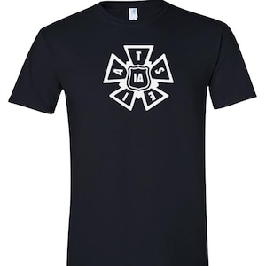 May include: Black t-shirt with a white graphic design. The design is a stylized emblem with the letters "IA" in the center, surrounded by the letters "A", "T", "S", "E", and "D". The shirt is a crew neck.