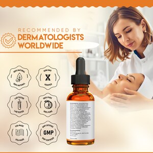 May include: An amber serum bottle with a black dropper is shown. The label lists ingredients and states "Recommended by Dermatologists Worldwide." The image includes icons indicating natural, lab-tested, and USA-made qualities. A woman's face is being treated in the background.