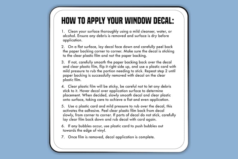 May include: White rectangular card with rounded corners, featuring black text: "HOW TO APPLY YOUR WINDOW DECAL:" followed by numbered instructions for applying a decal. The card is set against a light blue background.