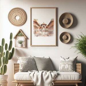 Pode incluir: Um design de interior de sala de estar com um sof&aacute; branco, duas almofadas, um cobertor e uma planta de cacto em um vaso. A parede atr&aacute;s do sof&aacute; tem uma pintura de aquarela emoldurada de um arco com um piso de ladrilhos e um teto de madeira. H&aacute; tamb&eacute;m tr&ecirc;s decora&ccedil;&otilde;es de parede.