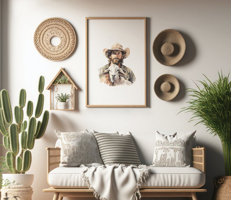 K&ouml;nnte beinhalten: Ein Aquarellbild eines Cowboys mit einem braunen Hut, der ein wei&szlig;es Lamm h&auml;lt. Das Bild ist in einem hellen Holzrahmen gerahmt und h&auml;ngt an einer wei&szlig;en Wand.