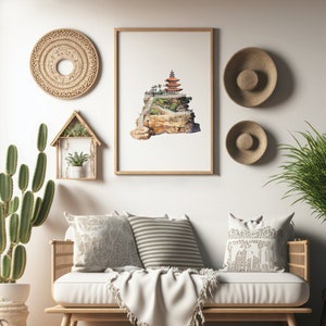 May include: A white couch with a white throw blanket and three pillows. The pillows are patterned with a floral design, stripes, and a geometric design. The couch is in front of a white wall with a framed print of a watercolor painting of a pagoda on a cliff. There are two woven wall hangings and a wooden shelf with a potted plant.