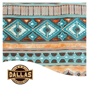 May include: Close-up of a patterned leather textile with a Southwestern design. The pattern features turquoise, orange, and white geometric shapes and stripes. The Dallas Leather Co. logo is in the bottom left corner.