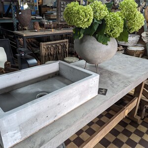 Solid cast concrete sink