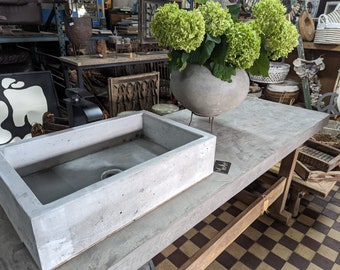 Solid cast concrete sink