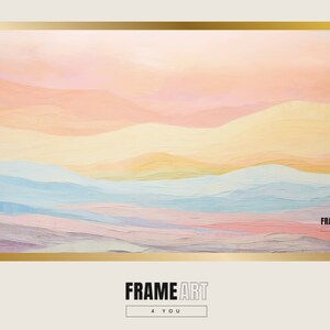 May include: Abstract art print with a colorful landscape of pink, yellow, blue, and purple hues. The print is framed in gold and has the text "FRAME ART 4 YOU" at the bottom.