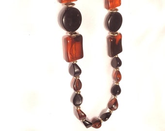 Vintage Amber colored resin or Bakelite necklace with brass bead accents