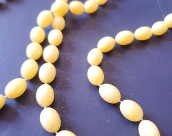 Double strand soft yellow vintage beads 52" long!