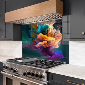 May include: A colorful abstract design printed on a glass backsplash for a kitchen stove. The design features swirling clouds of teal, orange, yellow, pink, and purple.