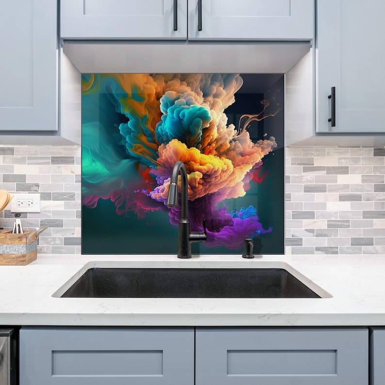 May include: A black kitchen sink with a black faucet and a colorful abstract art glass backsplash. The backsplash features a swirling design of blue, purple, orange, and yellow.