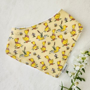 Cute duckling dribble bib in adjustable toddler size for boys and girls or gender neutral baby shower gift