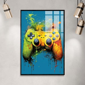 May include: A colorful abstract painting of a video game controller with splashes of yellow, green, red, and blue paint on a blue background.